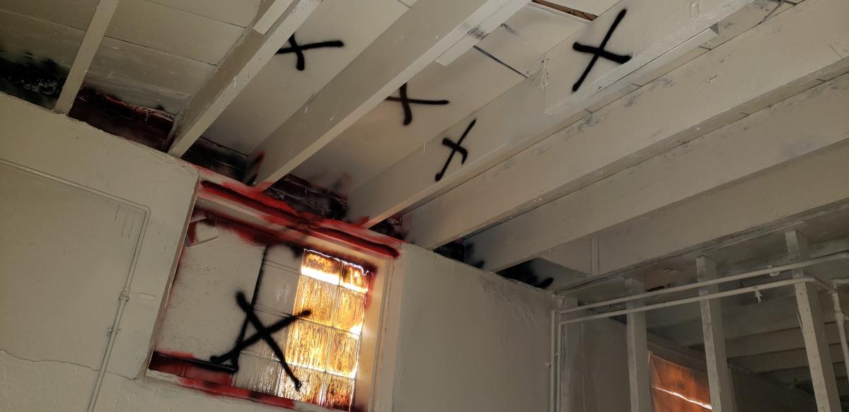 Damaged beams in ceiling of kitchen area