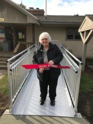 Chris McEnhill cutting opening ribbon