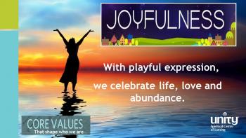 woman standing in short with hands raised